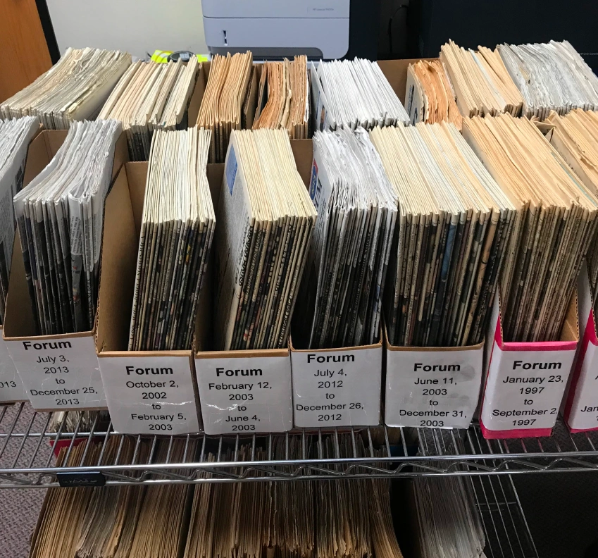 convert physical newspaper archives into digital formats