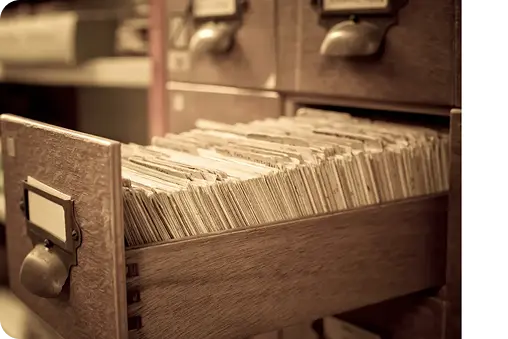Historical records and index cards prepared for archival document scanning