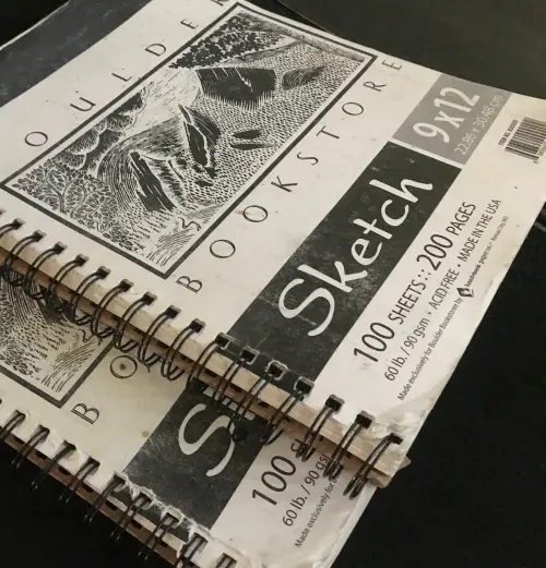 Spiral-bound sketchbooks prepared for high-resolution book scanning